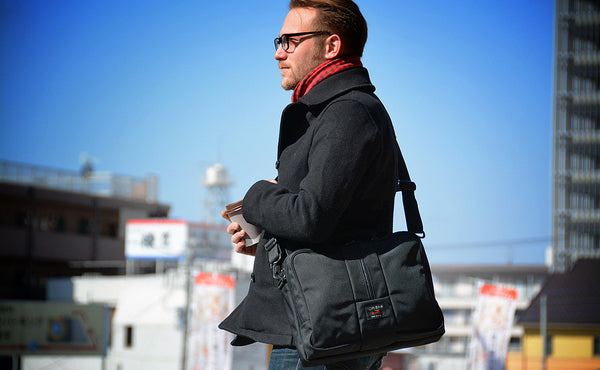 A profile shot of a person holding a Pilot.